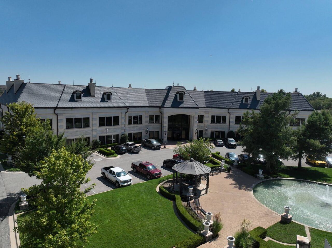 A large commercial campus building in Oklahoma City with a Champion Roofing installed roof